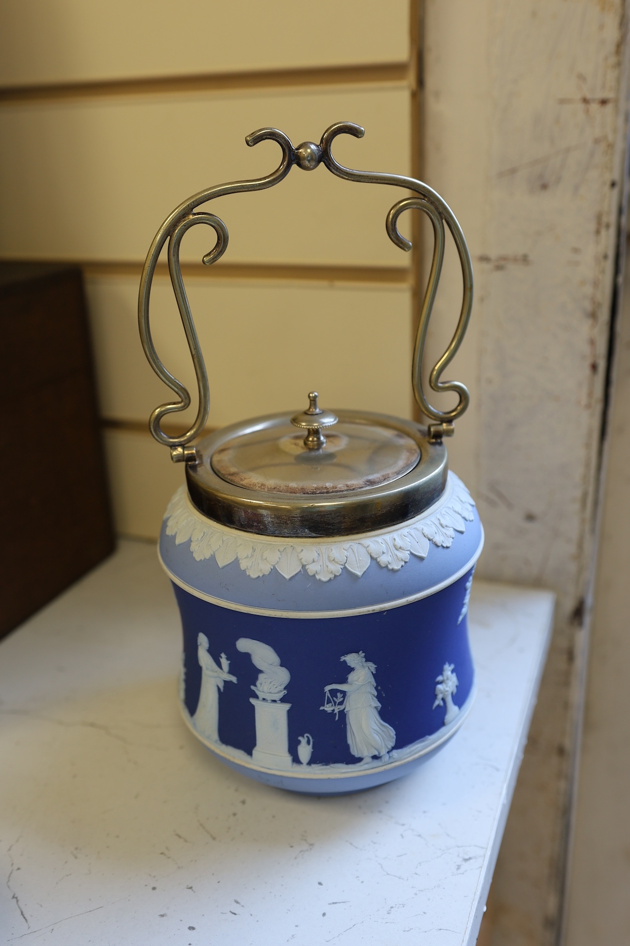 A Wedgwood three colour biscuit barrel with plated rim and handle, a Royal Worcester cup and saucer and a Dresden shaped bowl, biscuit barrel 17cm high. Condition - good